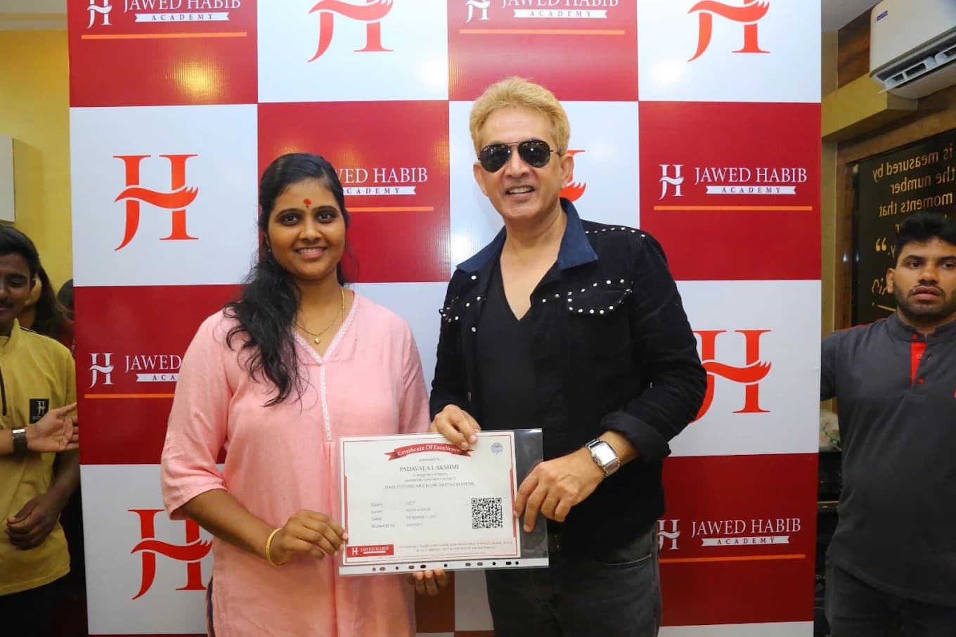 Swathi Mallepally receiving her Certificate of Excellence from Jawed Habib at Jawed Habib Academy